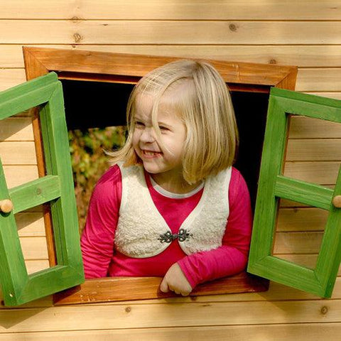Image of meisje-lacht-en-kijkt-door-kijkraam-van-speelhuis-lisa